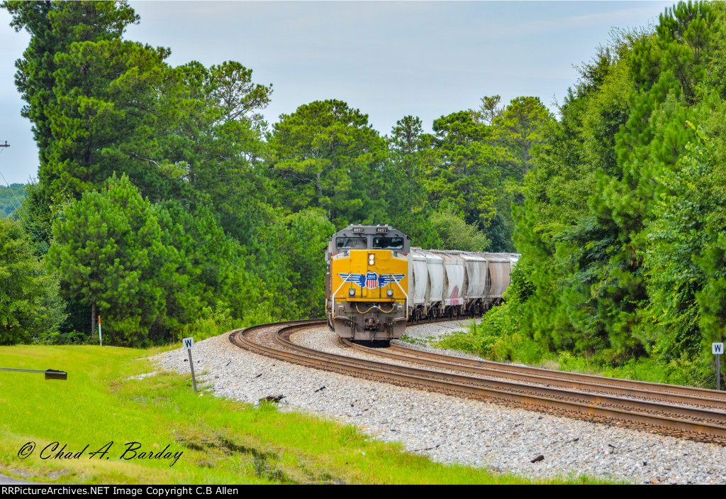 A WB Grain Train Patiently Awaits the Clearing of a Wreck Ahead